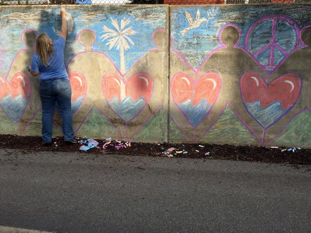 <p>An artist spreads love and hope through her artwork on the walls of the Lincoln Street tunnel.</p>
