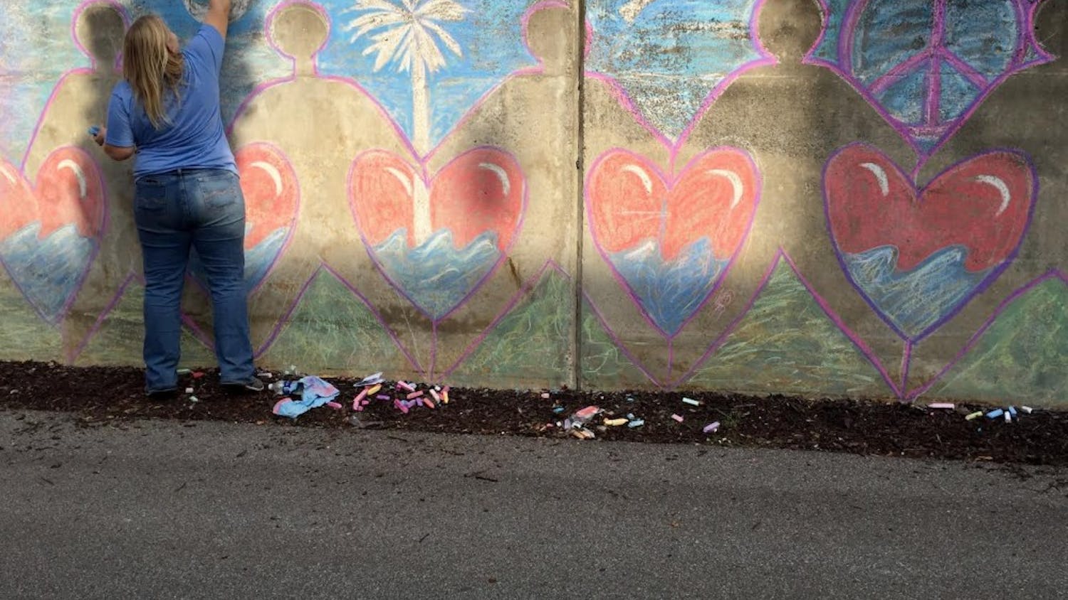 An artist spreads love and hope through her artwork on the walls of the Lincoln Street tunnel.