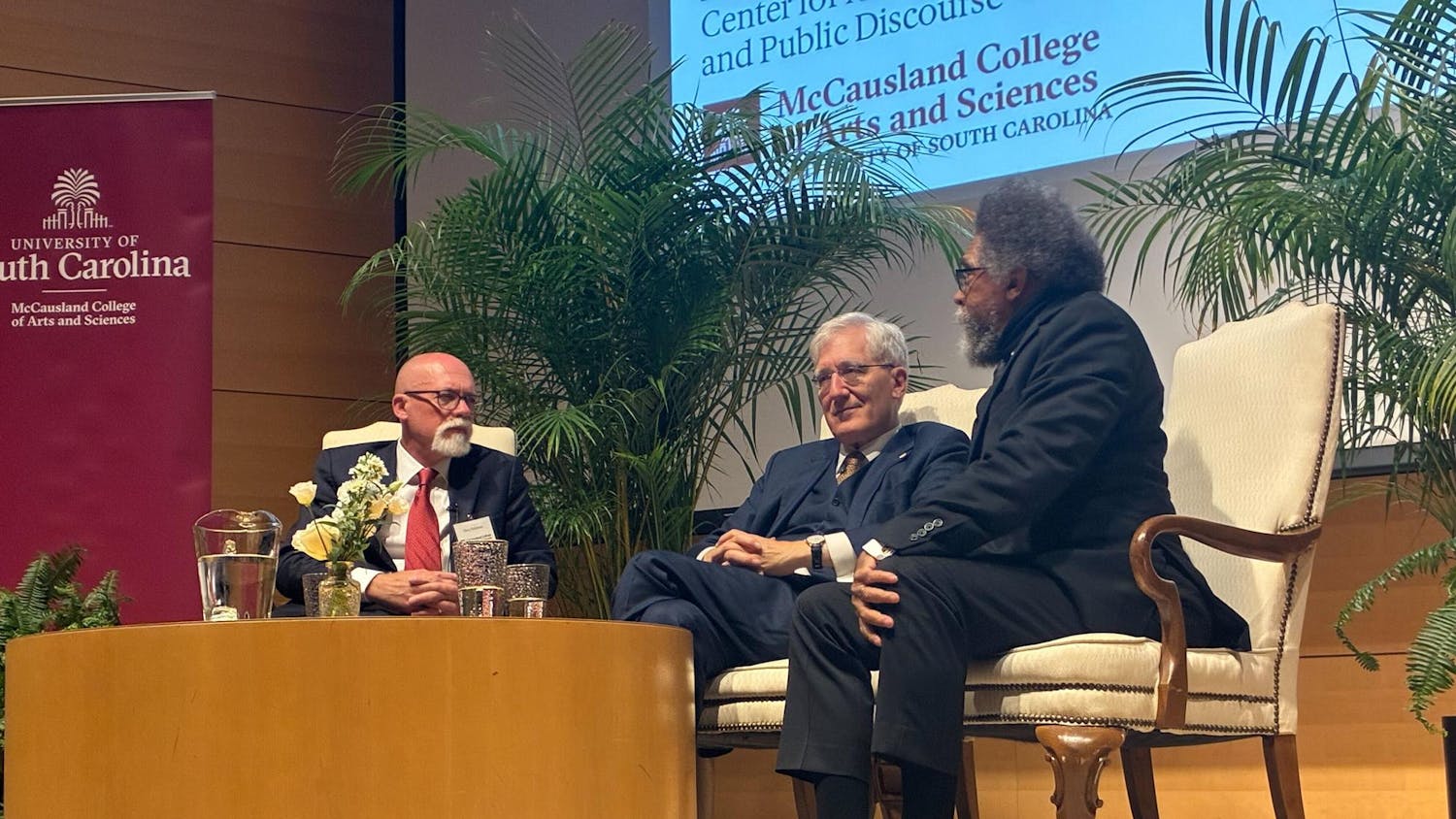 Cornel West (right) speaks on stage with Robert P. George and Interim Executive Director of the Center for American Civic Leadership and Public Discourse Christopher Tollefsen (left) during the center's first event at the Darla Moore School of Business on Sept. 12.