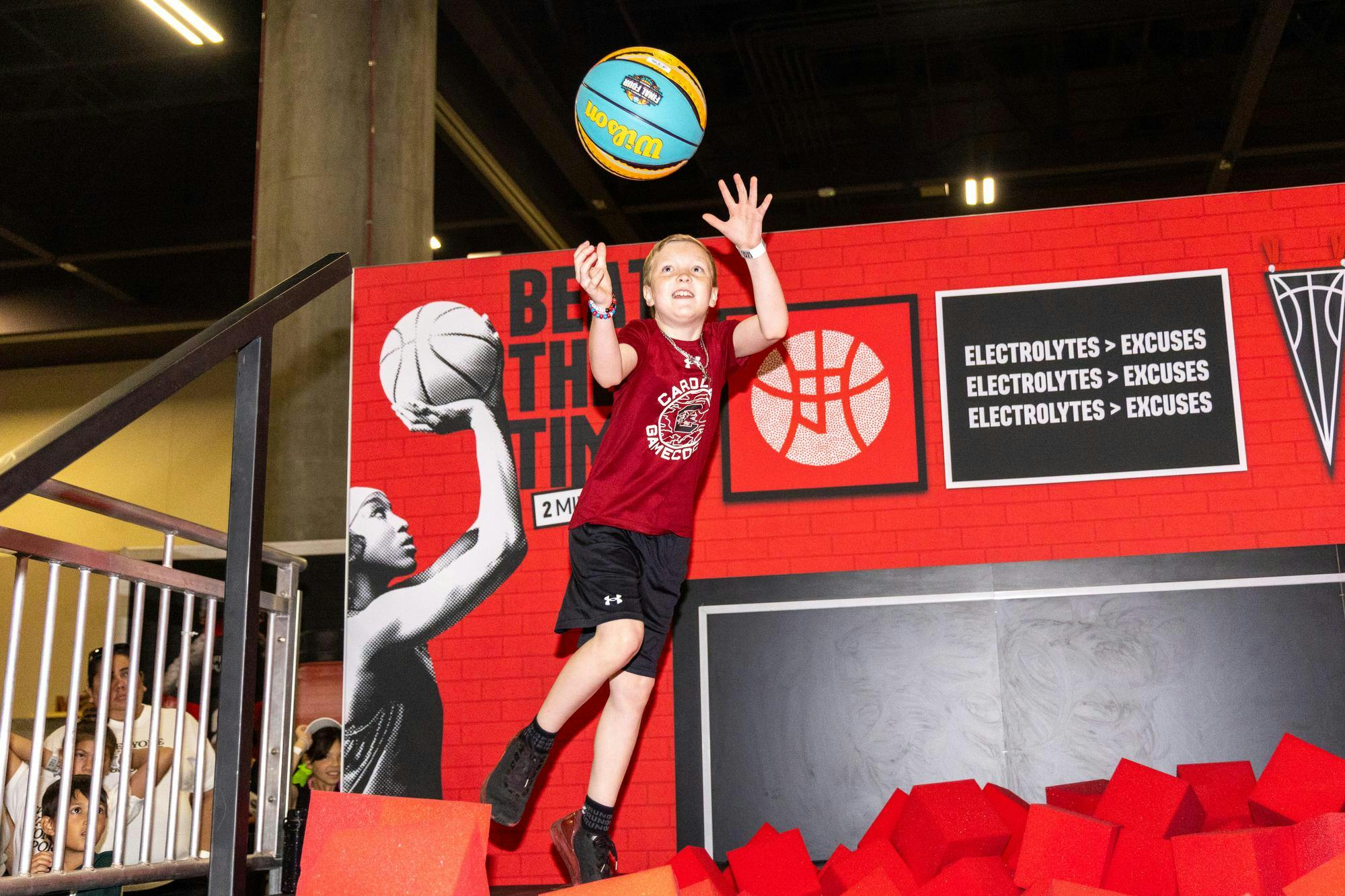 Myrtle Beach resident Landon Ross jumps to catch a ball during a time trial game at Tourney Town during the Final Four in Phoenix, Arizona, on April 3, 2026. Ross said he hopes to cheer the Gamecocks on to a championship win.
