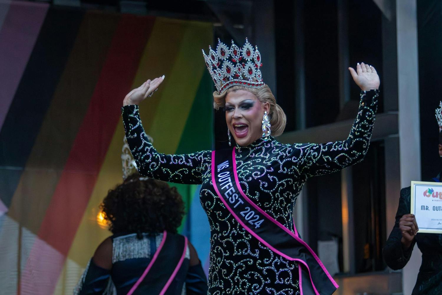 Drag performer Colbi J with her hands raised after winning Ms. Outfest 2024 on June 1, 2024. Outfest, hosted by South Carolina Pride, also has a drag pageant with three different titles to win: Mr., Ms., and Mx.