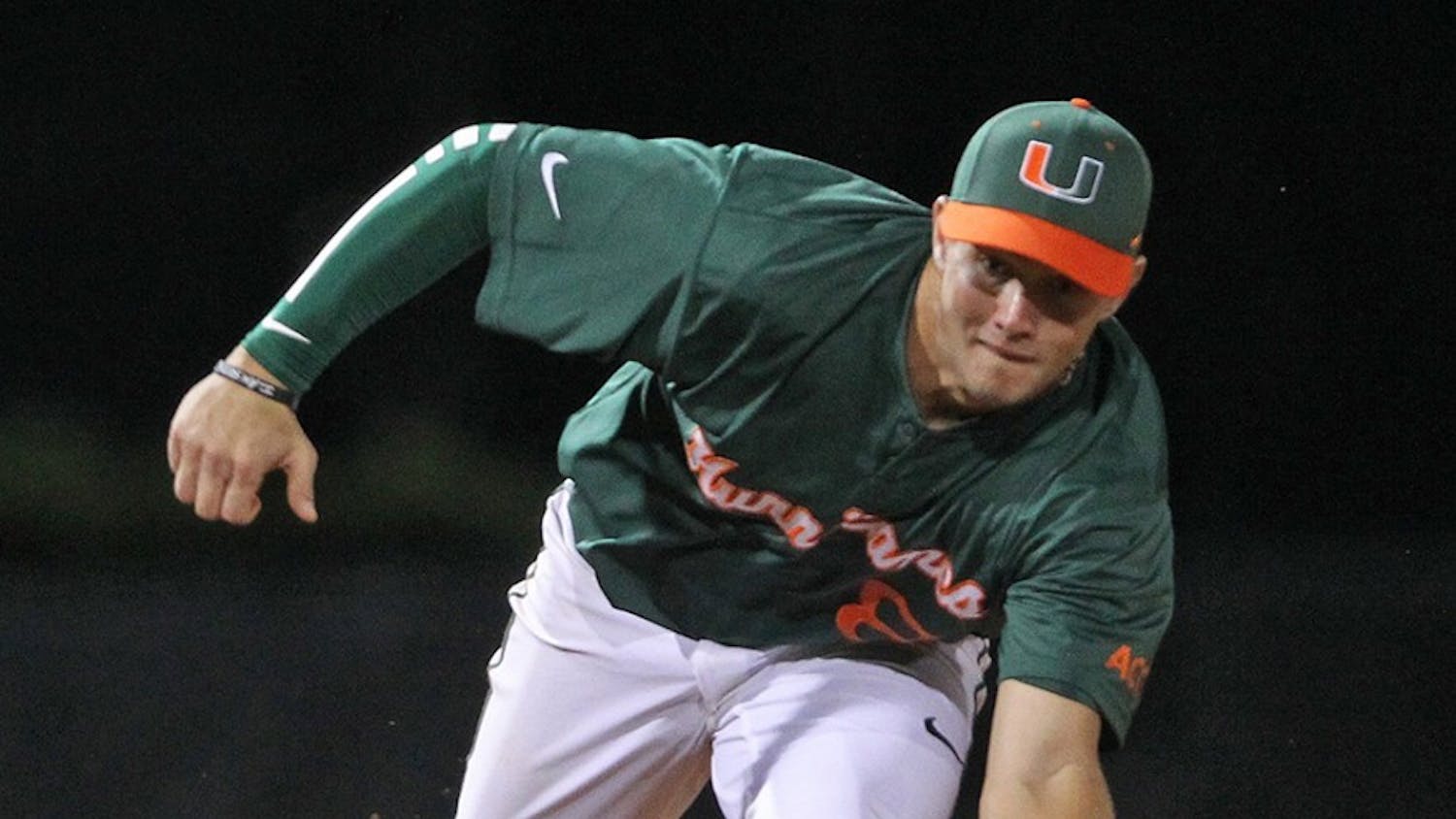 Miami's David Thompson misses an infield grounder in the third inning against Maine at Alex Rodriguez Park at Mark Light Field in Coral Gables, Fla., on Saturday, Feb. 15, 2014. Maine won, 3-1. (Al Diaz/Miami Herald/MCT)