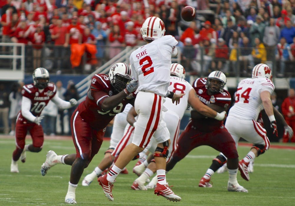 	Wisconsin quarterback Joel Stave completed 7 of 11 passes in the first half for 64 yards and two touchdowns in the Jan. 1 Capital One Bowl. 