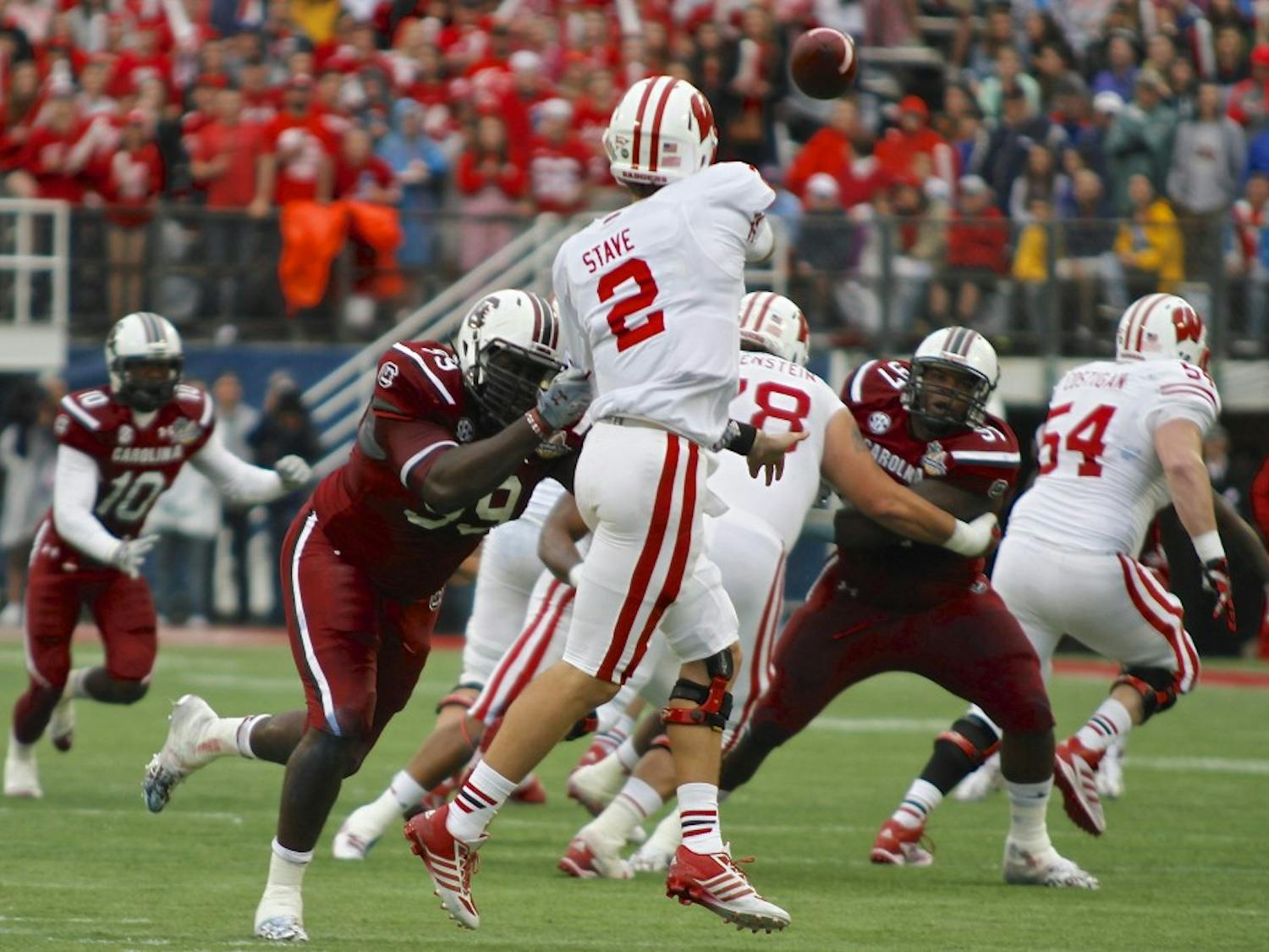 	Wisconsin quarterback Joel Stave completed 7 of 11 passes in the first half for 64 yards and two touchdowns in the Jan. 1 Capital One Bowl. 