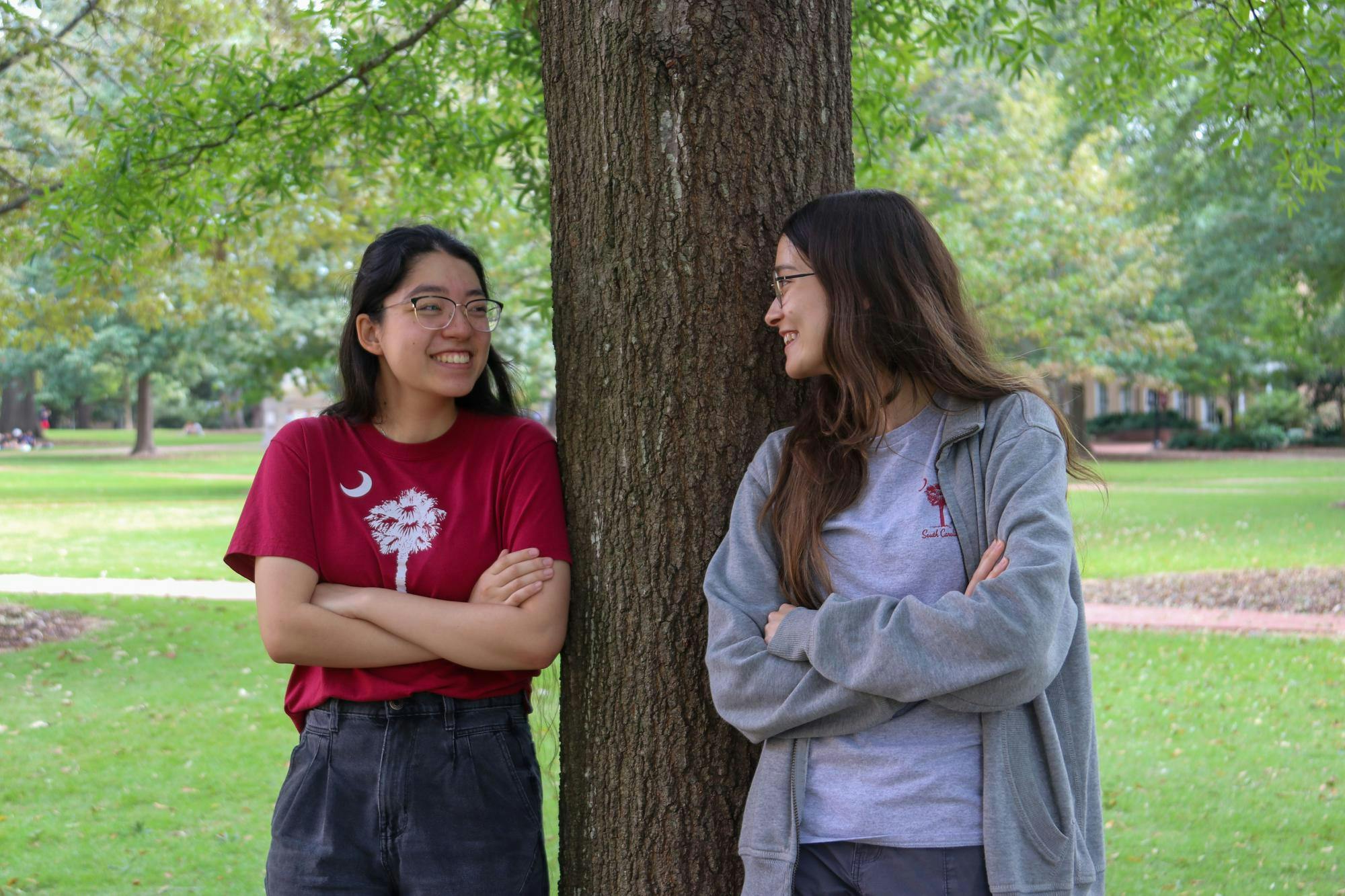 Third-year biology student Gianna Mancine (left) and first-year pharmacy student Jasmine Whatley (right) pose for a picture on the Horseshoe on Oct. 4, 2024. Mancine and Whatley are the president and vice president of Cocks vs. Zombies, a club that hosts a campus-wide game of tag.