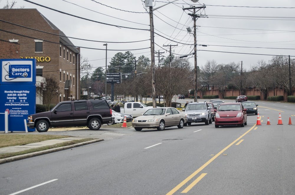 	The line of cars waiting to park at the new Trader Joe&#8217;s stretched down the block.