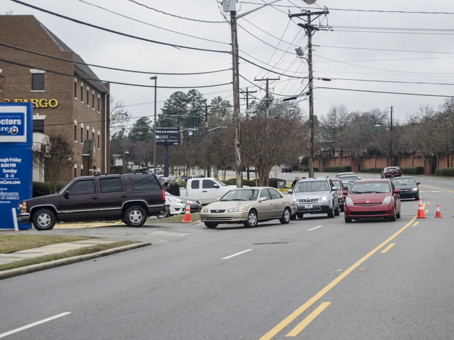 The line of cars waiting to park at the new Trader Joe’s stretched down the block.