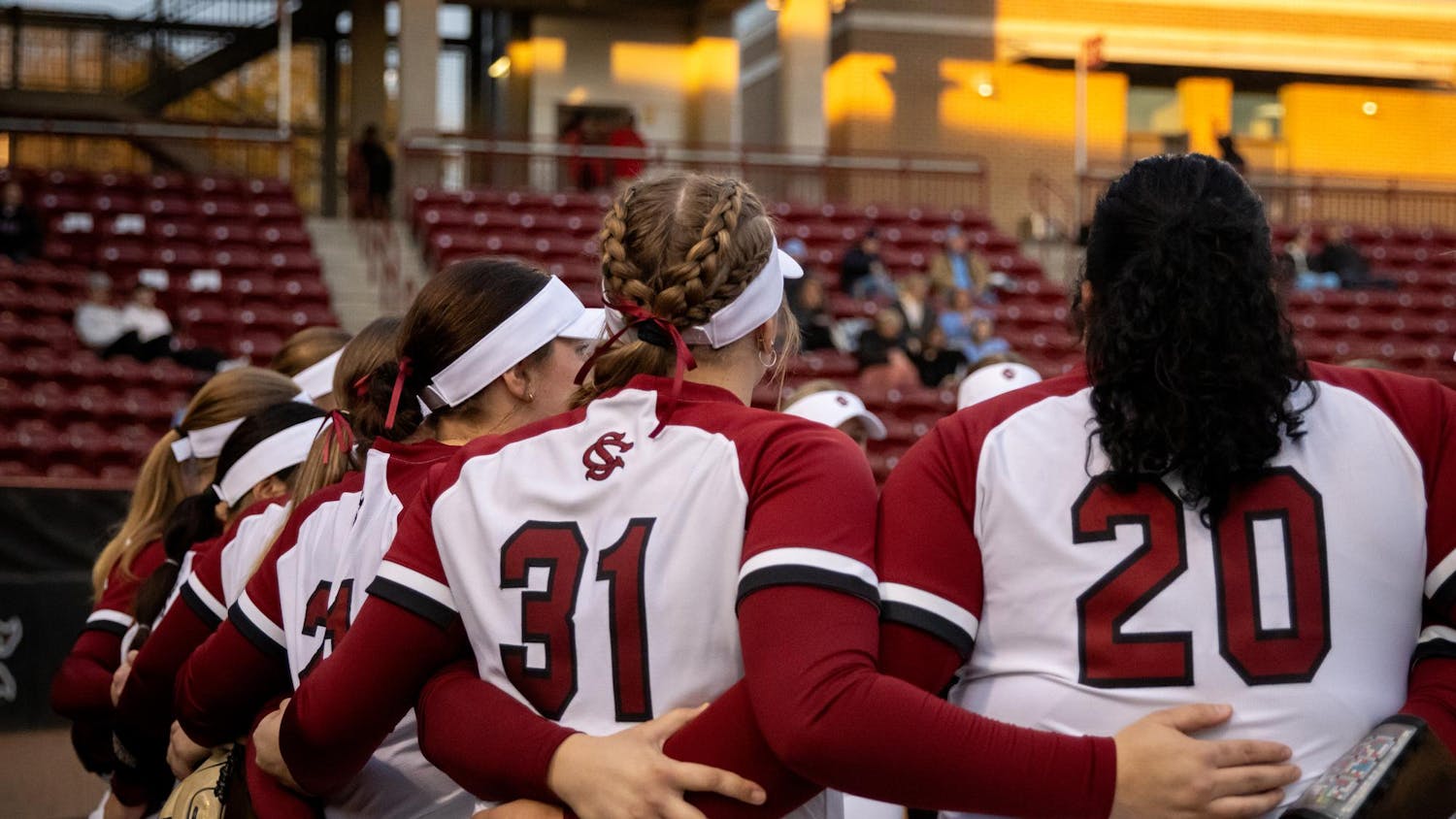 FILE — University of South Carolina softball players embrace each other during pregame festivities at Beckham Field on Feb. 19, 2025. The Gamecocks are 22-5 on the season and started the season with 20 straight wins.
