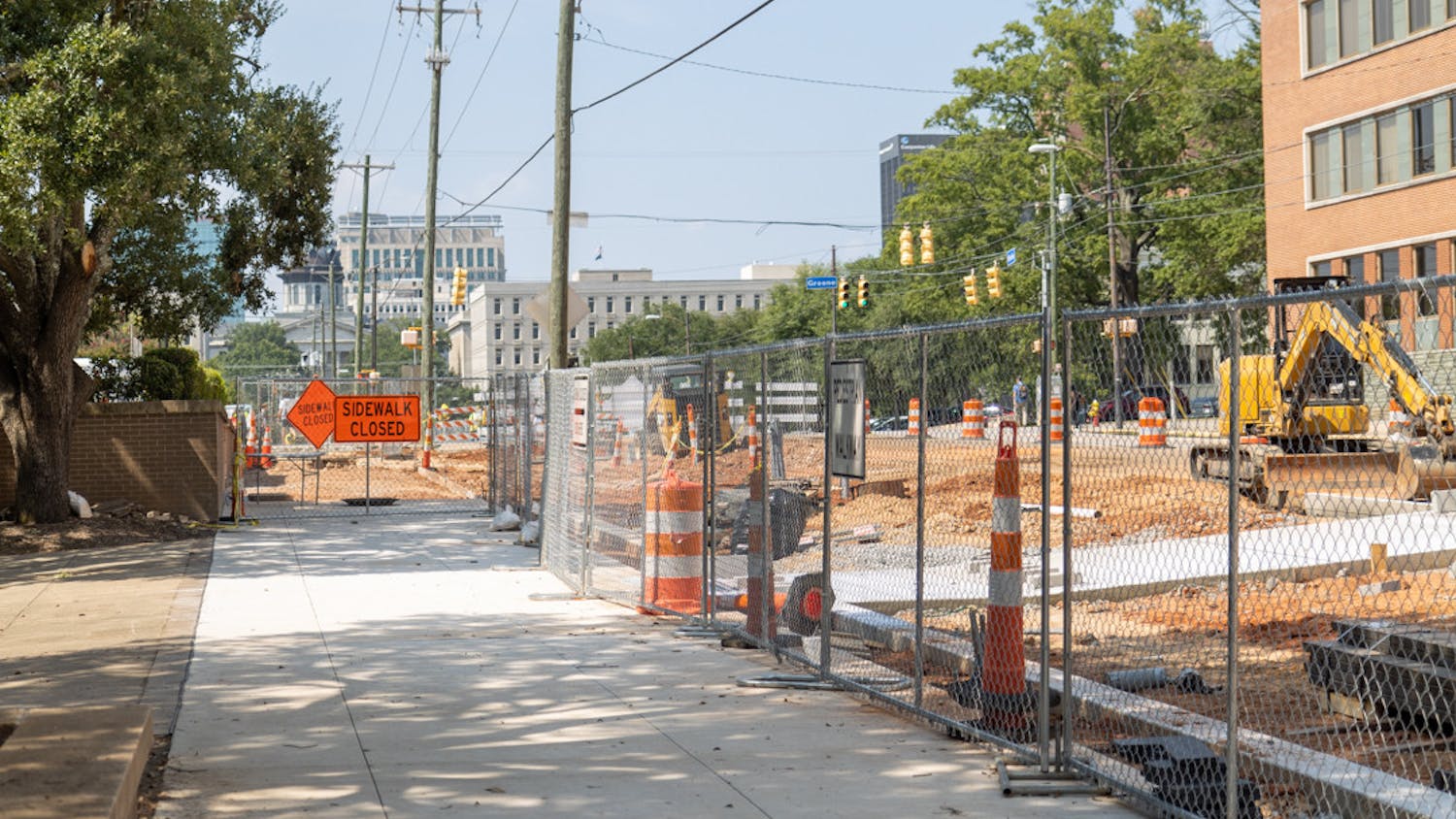 Ongoing construction at the corner of South Main Street and Greene Street closes the sidewalk beside the University of South Carolina D2 parking lot on Aug. 25, 2023. The South Main Street construction project plans to transform the area to be safer for bikes, cars and pedestrians.