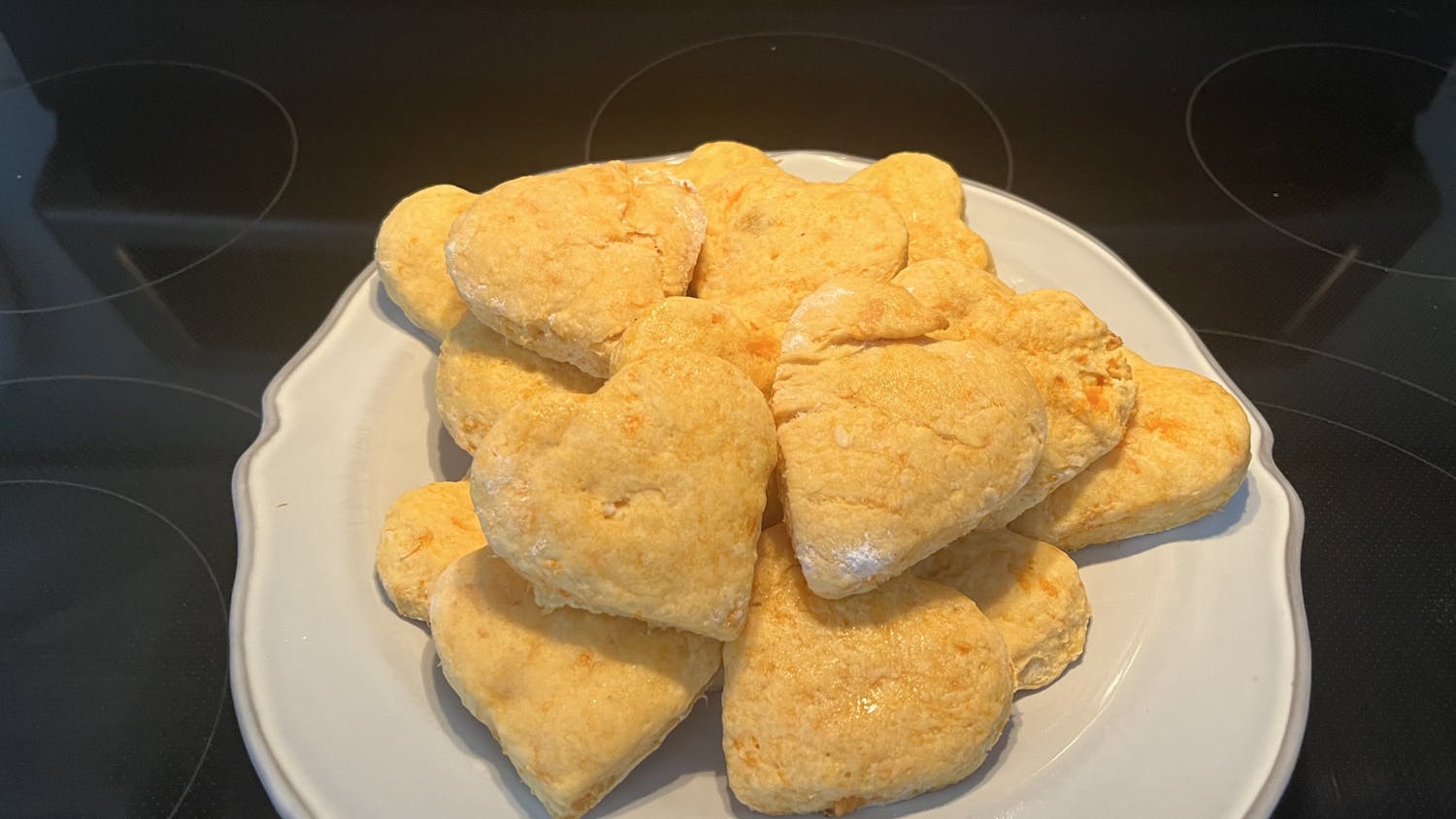 A pile of delicious, heart-shaped sweet potato biscuits sit on a plate on Jan. 29, 2023. This easy-to-make recipe makes for a great Valentine's Day treat.