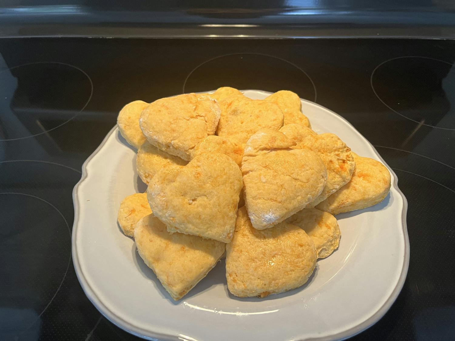 A pile of delicious, heart-shaped sweet potato biscuits sit on a plate on Jan. 29, 2023. This easy-to-make recipe makes for a great Valentine's Day treat.