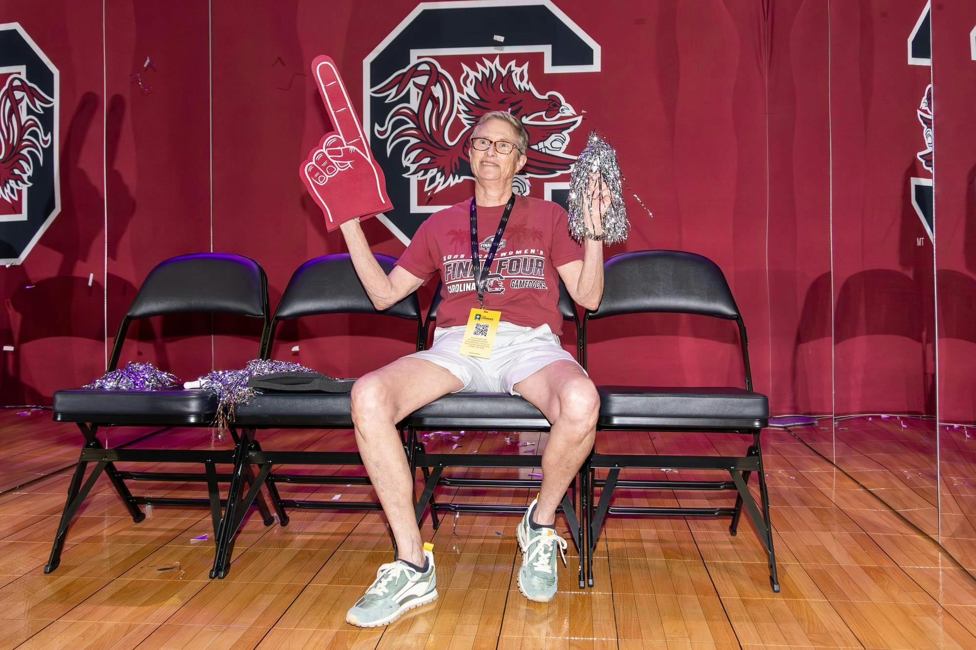 Asheville, North Carolina, resident Linda Sharp poses in front of a Gamecocks-themed photo booth at Tourney Town in Phoenix, Arizona, during the Final Four on April 3, 2026. Sharp said Staley has cultivated a great team and is hoping for a championship win.