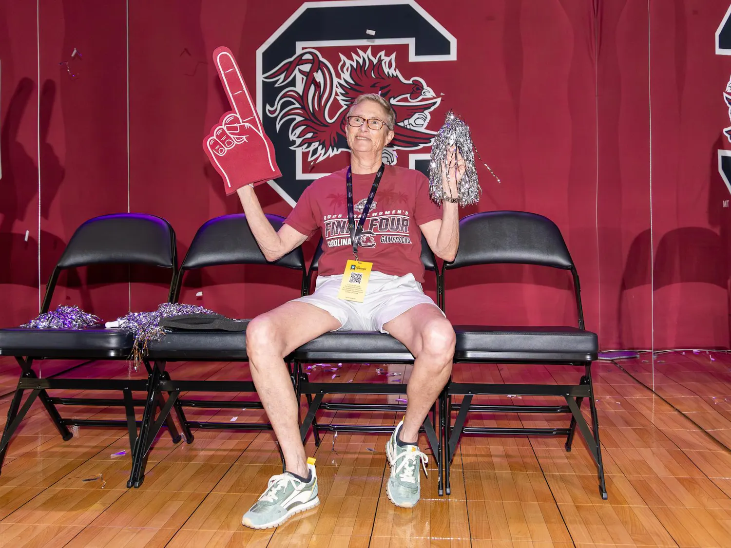 Asheville, North Carolina, resident Linda Sharp poses in front of a Gamecocks-themed photo booth at Tourney Town in Phoenix, Arizona, during the Final Four on April 3, 2026. Sharp said Staley has cultivated a great team and is hoping for a championship win.