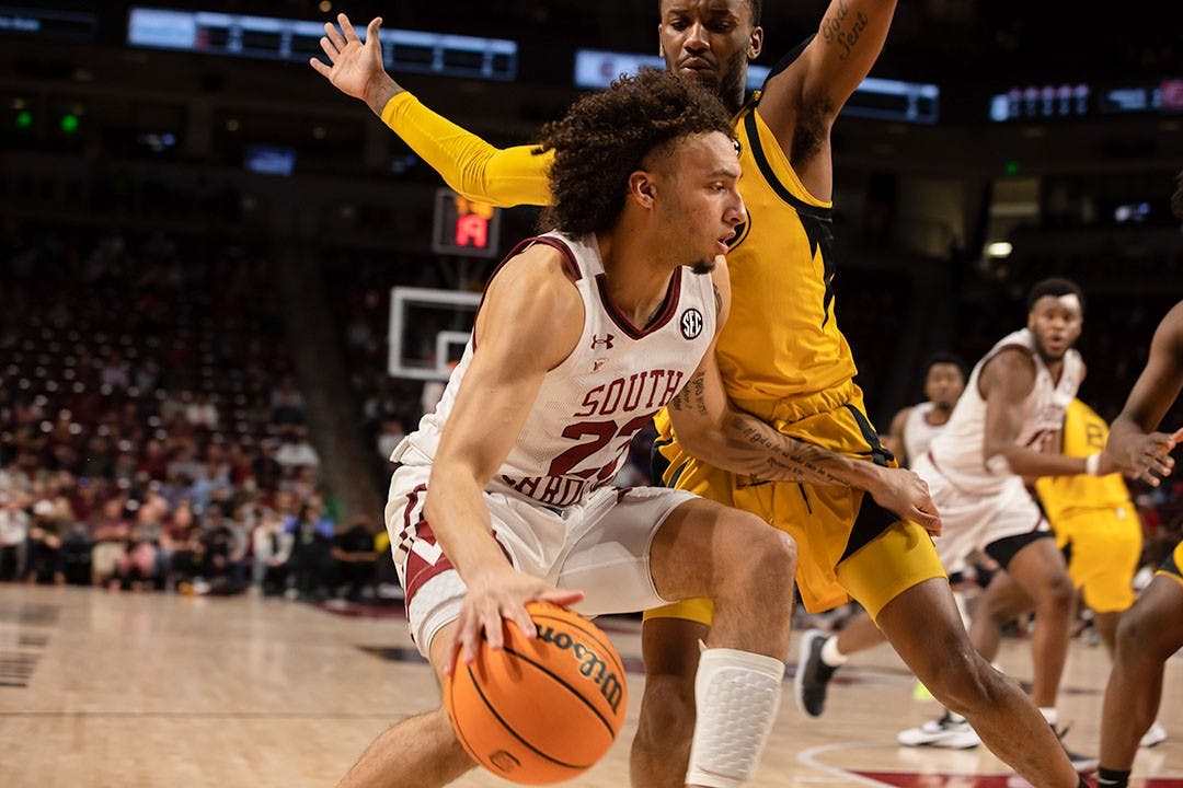 FILE— Freshman Devin Carter being defended by the Missouri Tigers on March 1st, 2022.&nbsp;