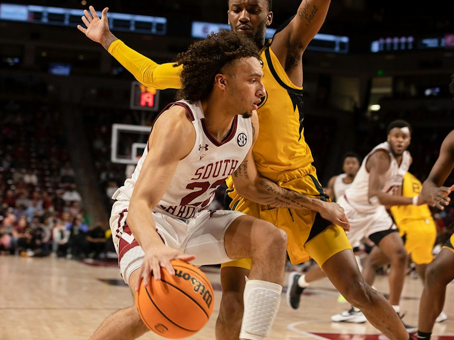 FILE— Freshman Devin Carter being defended by the Missouri Tigers on March 1st, 2022. 