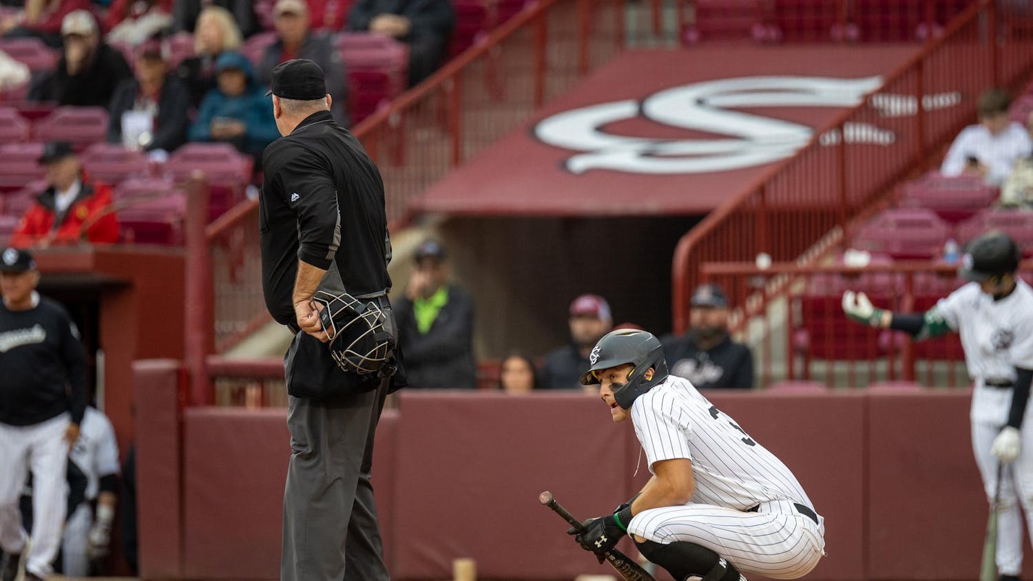 Junior outfielder Nathan Hall squats after being hit by a pitch during South Carolina’s game against Sacred Heart University on Feb. 15, 2025. The Gamecocks defeated the Pioneers 14-0. 