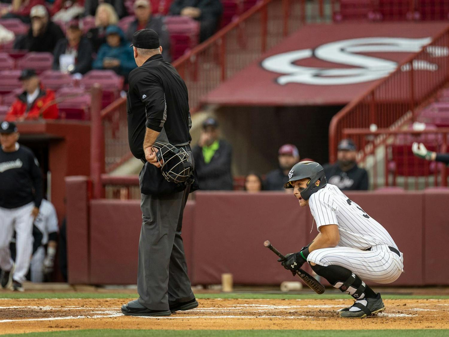 Junior outfielder Nathan Hall squats after being hit by a pitch during South Carolina’s game against Sacred Heart University on Feb. 15, 2025. The Gamecocks defeated the Pioneers 14-0. 