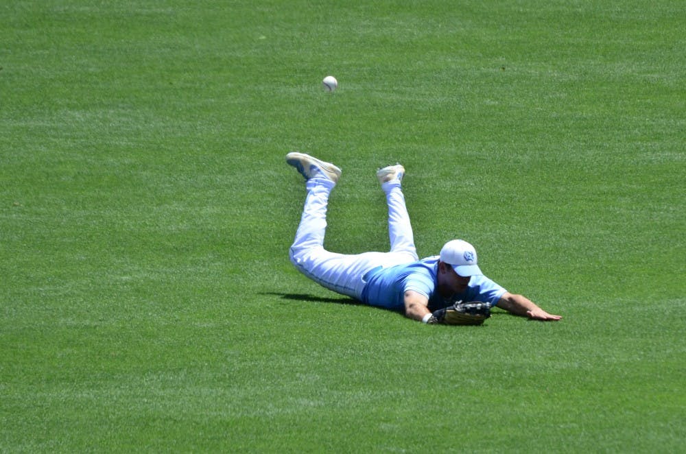 UNC outfielder misses a catch.