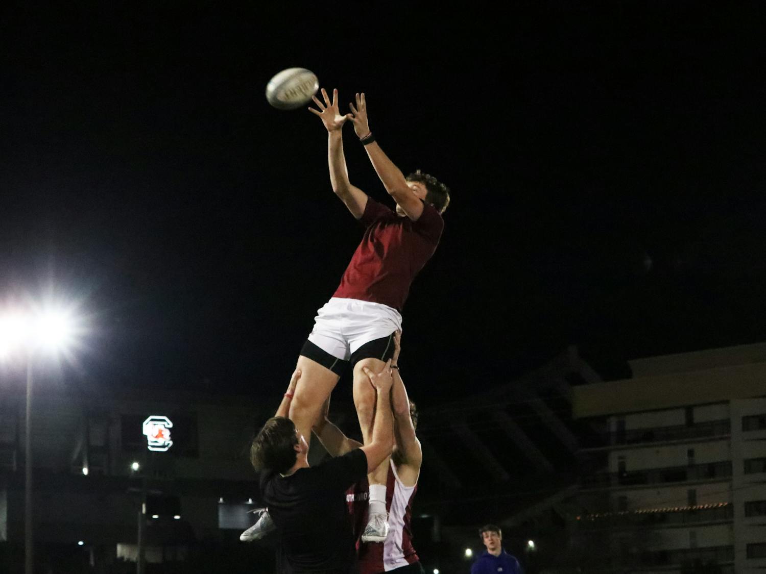 Gamecock men’s rugby captain junior Grant Howard and teammates practice lineout runs at the Bluff Road Park practice fields on Feb. 7, 2023. Many students involved in club sports find their teammates to be a reliable source when it comes to relieving the stressors of school and everyday life.