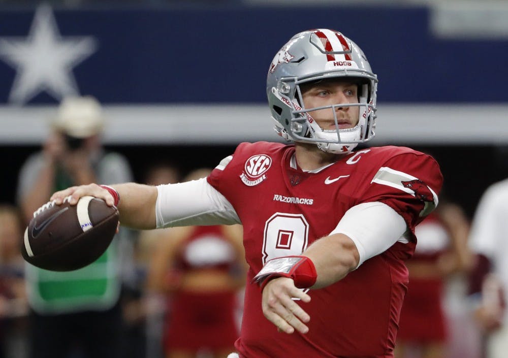 Arkansas Razorbacks quarterback Austin Allen (8) looking for a receiver in the first quarter against the Texas A&M Aggies on Saturday, Sept. 23, 2017 in the Southwest Classic in Arlington, Texas. (Paul Moseley/Fort Worth Star-Telegram/TNS)