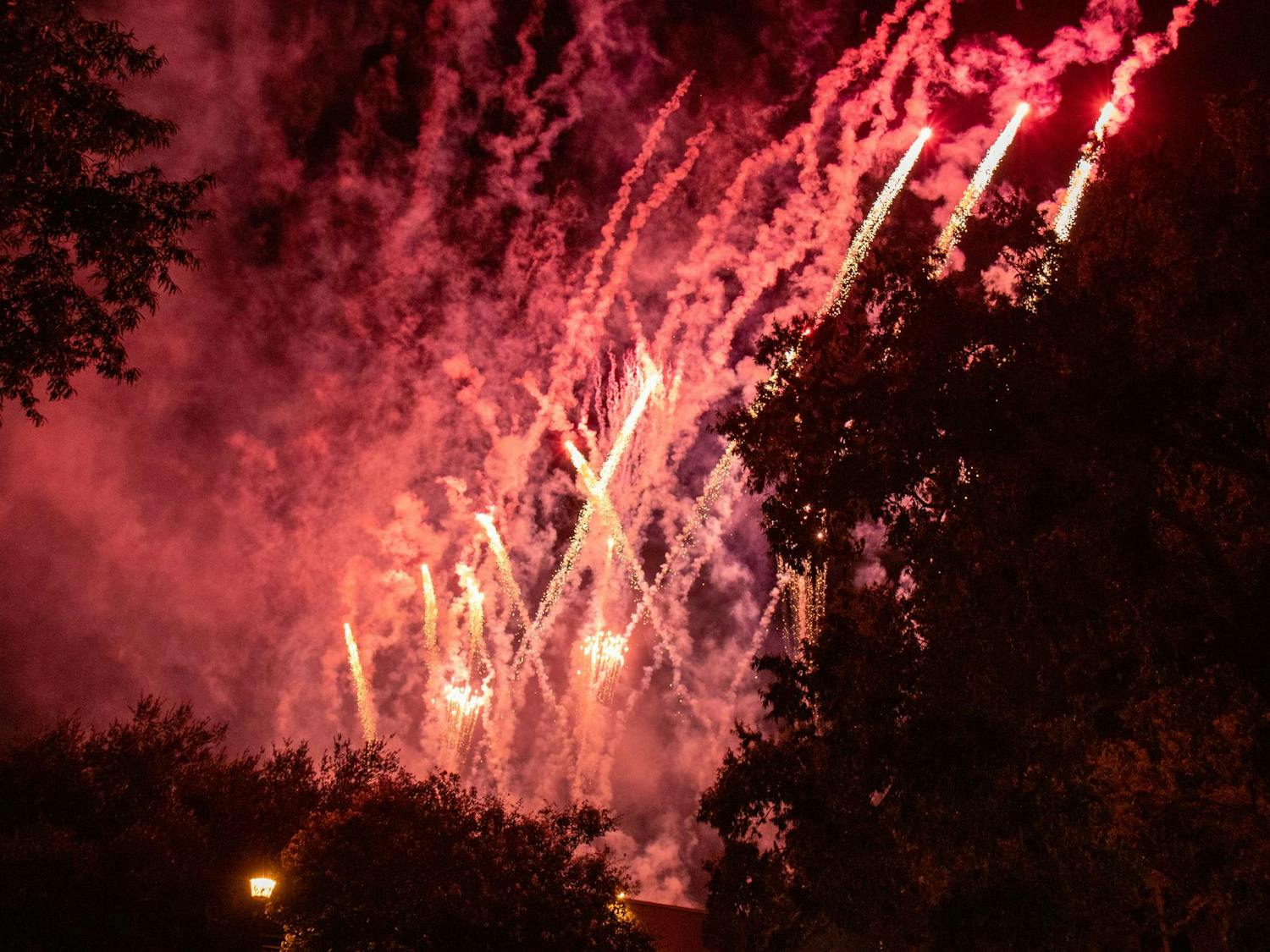 Fireworks are set off on the top of Russell House during First Night Carolina on Aug. 23, 2023. During the show, students gathered across Greene Street to watch the display and enjoy other free activities.