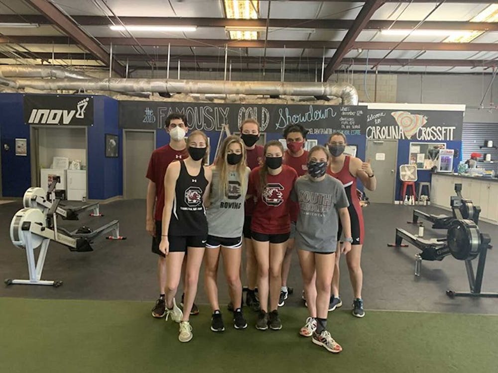 Members of the Gamecock Rowing Club pose for a team photo at the gym.