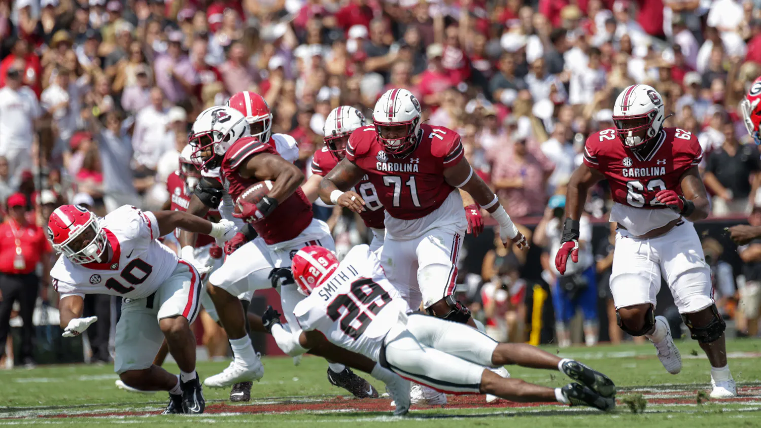 Redshirt Sophomore Running Back MarShawn Lloyd runs the ball with Georgia’s defense close behind at South Carolina’s matchup against Georgia on Sep. 17, 2022.