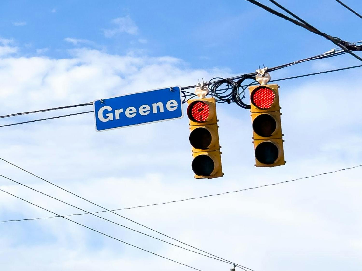 A sign reading Greene Street hangs over the intersection of Greene Street and Main Street in Columbia, SC on Feb. 19, 2024. The intersection was the scene of an incident where a 鶹С򽴫ý student riding a scooter was hit by a truck while crossing the street on Monday afternoon.
