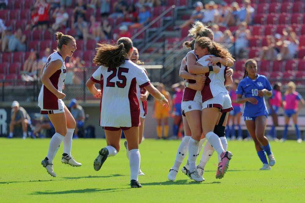 <p>Freshman forward Katie Shea Collins (farthest right) jumps to hug her teammates after scoring on a penalty kick at Stone Stadium on Sept. 22, 2024. The Gamecocks defeated the Kentucky Wildcats 1-0 in the team's first SEC match of the season.</p>