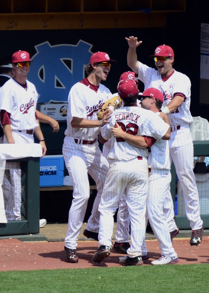 Teammates celebrate with Schrock.