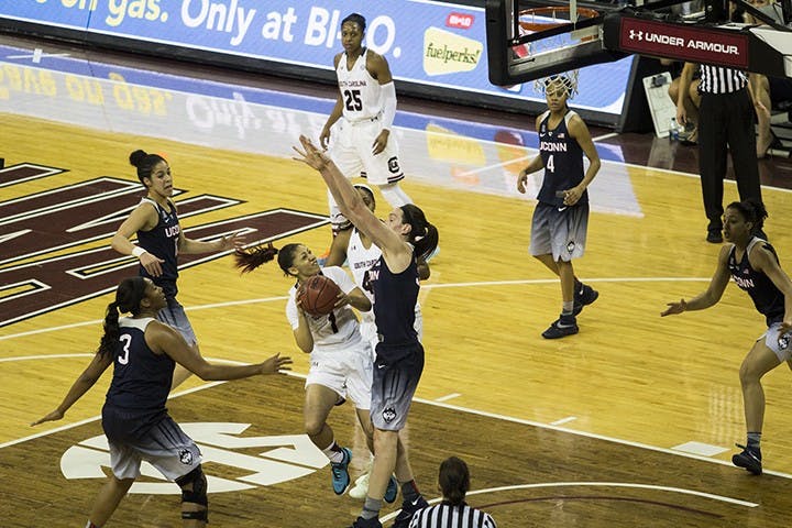 Bianca Cuevas attempts to take a shot against Breanna Stewart. Cuevas is good at fast breaks but is matched with Stewart's height. 