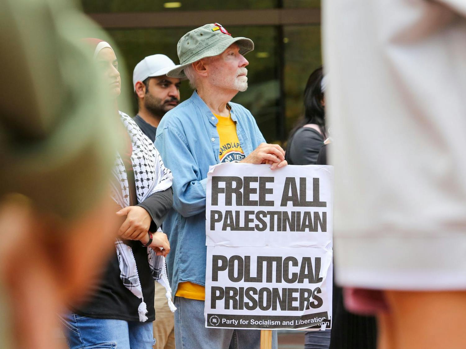 An attendee watches from the crowd during a walkout for Palestine on the Russell House Patio on Nov. 9, 2023. Members across USC's campus gathered to raise awareness for the monthlong conflict between Hamas and Israel.