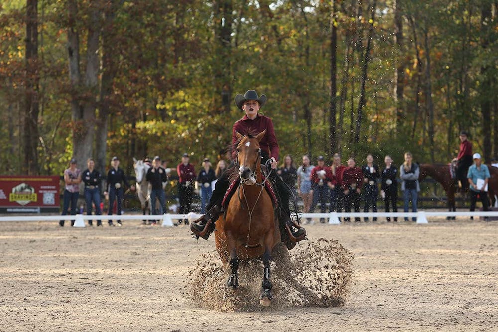 Sophomore Haley Turner mounted on Nike while competing in the reining event. Turner scored 69 points, bringing the Gamecocks total for reining to 4-0 over the Bulldogs at One Wood Farm on Nov. 12, 2022.