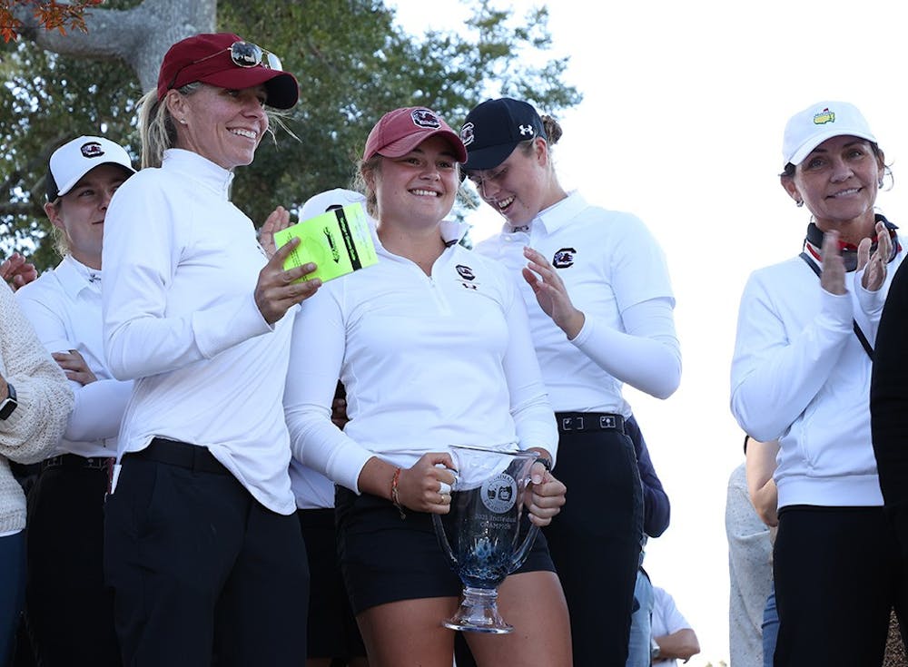 <p>Junior golfer Justine Fournand with a trophy for her individual win at Landfall.&nbsp;</p>