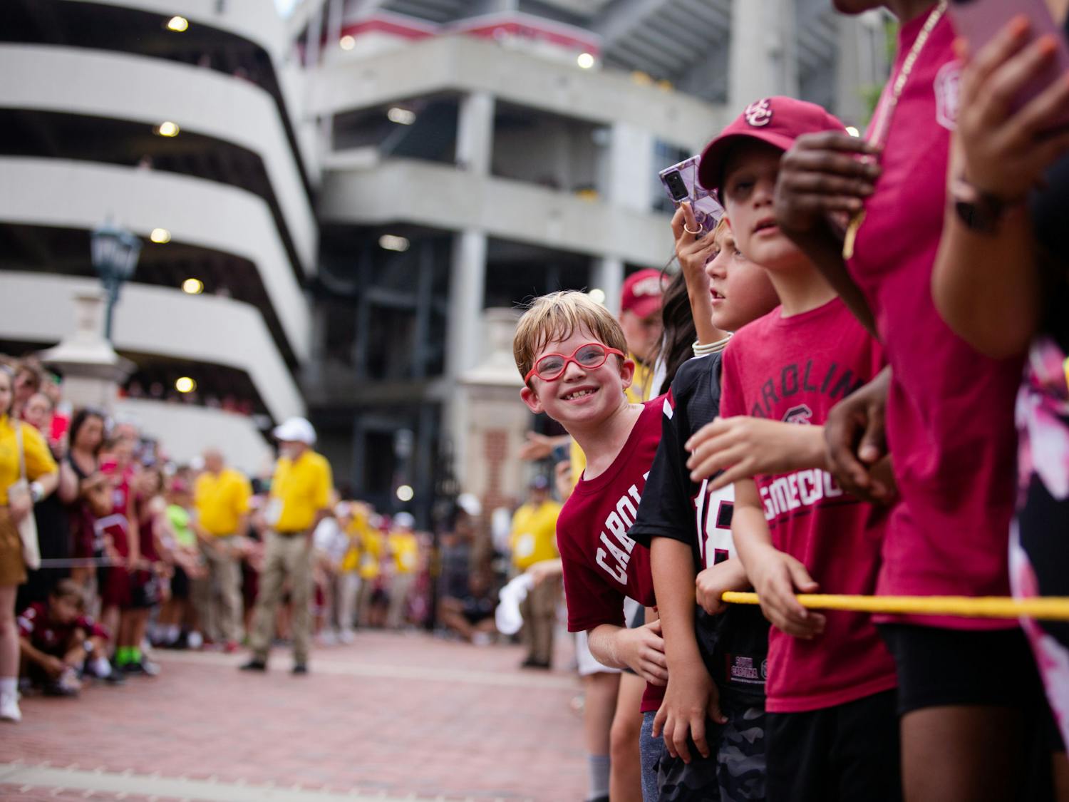 A young fan smiles while waiting for the South Carolina football team to walk into the stadium. The Gamecocks won against Georgia State 35-14.&nbsp;