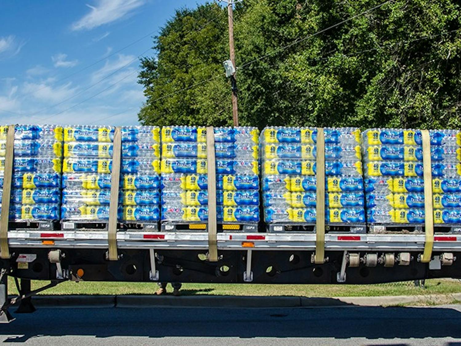 Pallets of water are delivered to Lower Richland High School for distribution on October 6.