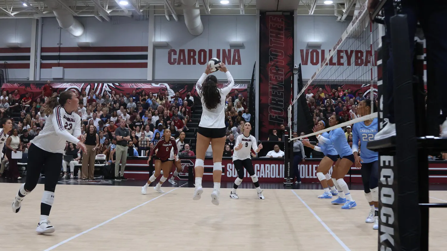 Senior setter Kimmie Thompson sets the ball over to her teammate to help get a point for the South Carolina Gamecocks. On Sept. 12, the Gamecocks played the 25th-ranked North Carolina Tar Heels in a nail-biter; the Gamecocks took the victory in five sets.