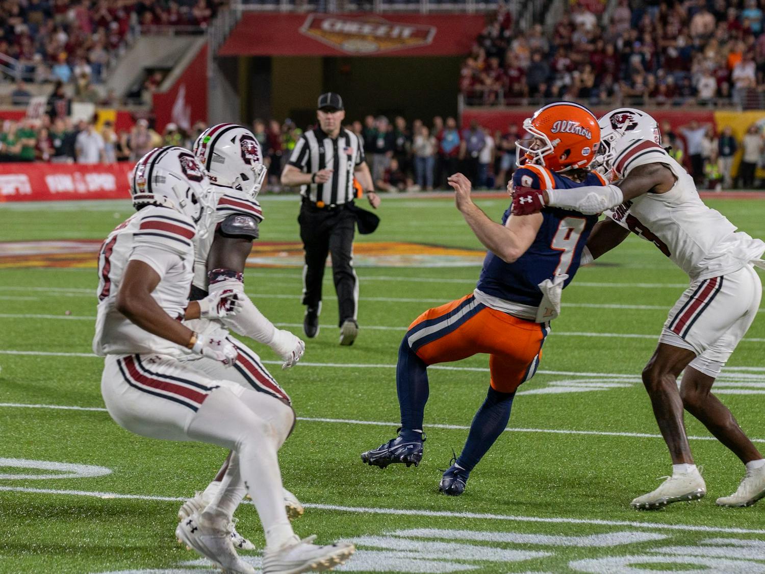 Redshirt senior defensive back O'Donnell Fortune (right) attempts to tackle an Illinois linebacker carrying the ball during the Cheez-It Citrus Bowl on Dec. 31, 2024. The Gamecocks lost to the Fighting Illini 21-17.