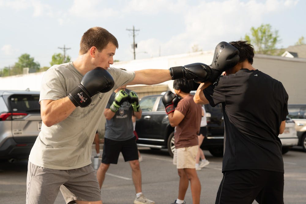 <p>Boxing Club members Noah Webber (left) and Mateo (right) spar during practice on March 23, 2026. The practice included multiple drills to help fighters learn new techniques.</p>
