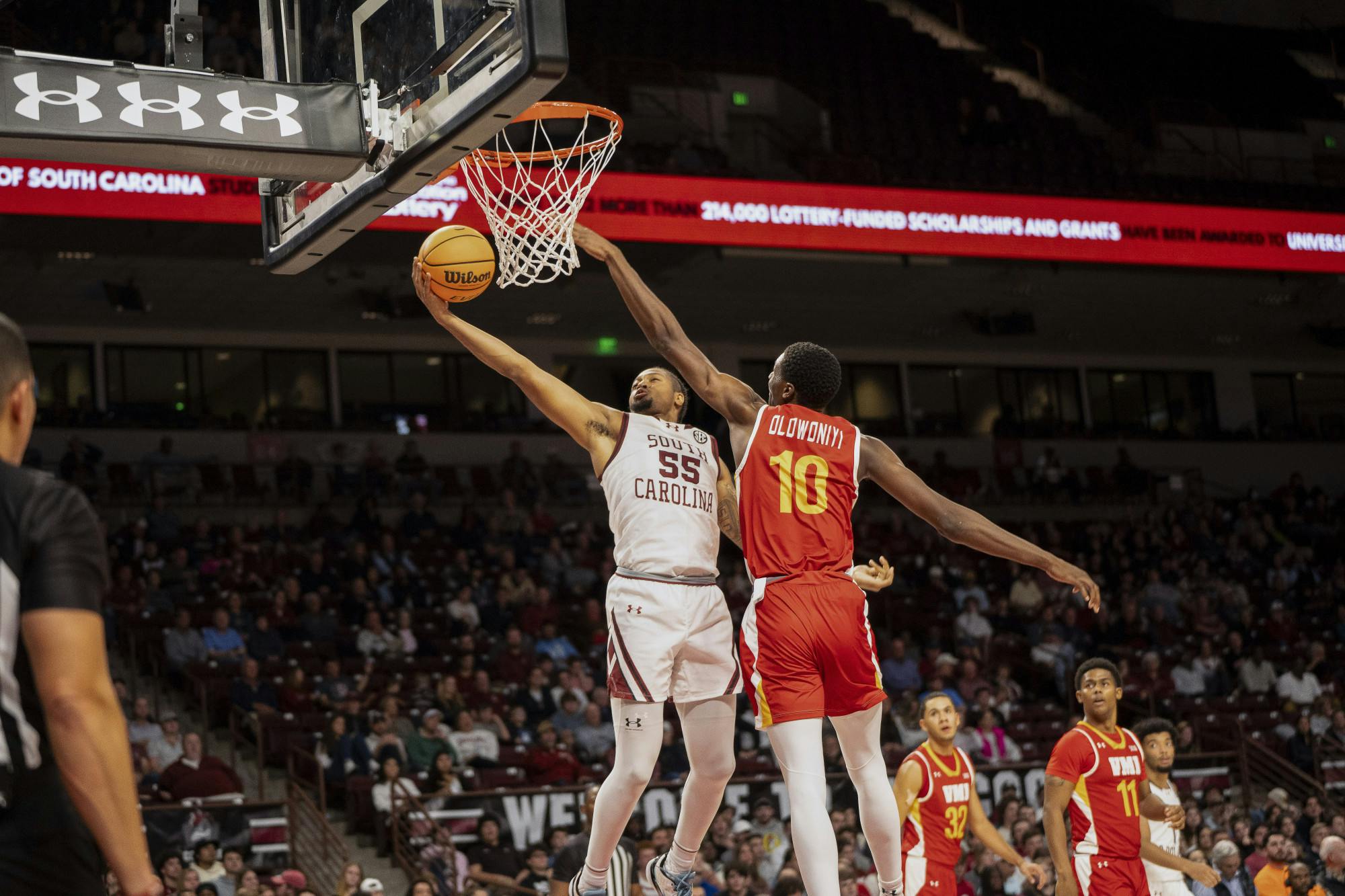 Graduate student guard Ta'Lon Cooper attempts a layup around a Virginia Military Institute player on Nov. 13, 2023. Cooper has an astounding 1,105 career points and scored an additional 7 against VMI.