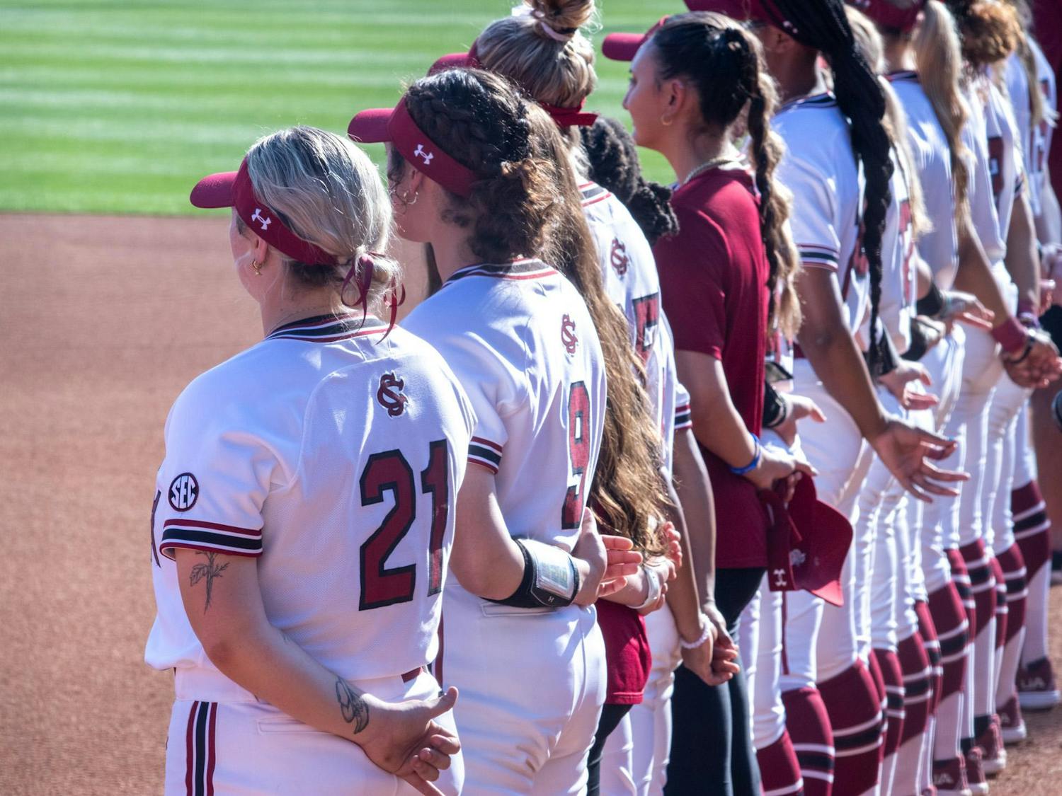 Redshirt sophomore infielder Natalie Heath lines up alongside her teammates for the playing of the national anthem on March 14, 2024. The Gamecocks kicked off the Garnet and Black Invitational with a 3-0 win over Boston University.