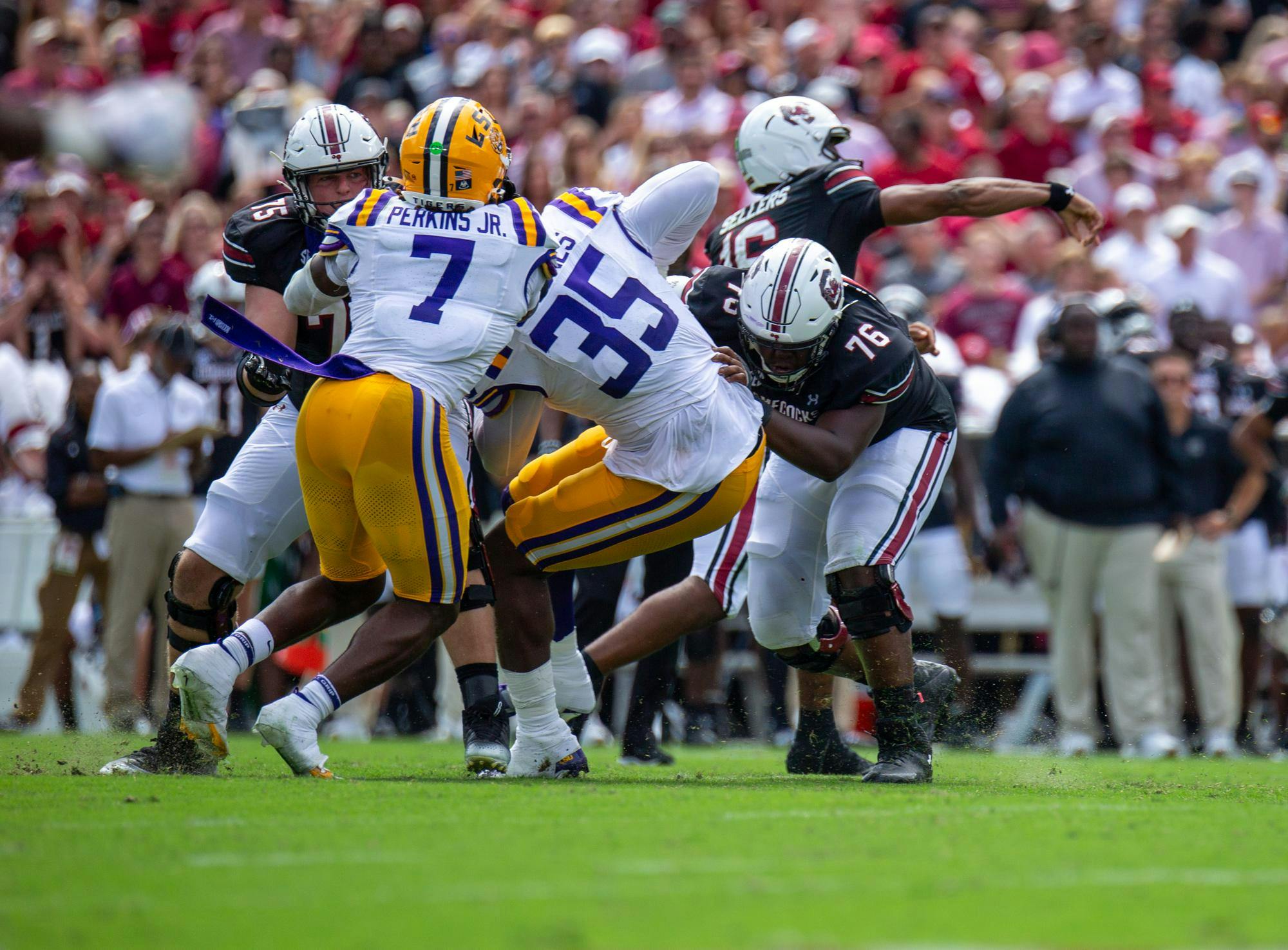 FILE — South Carolina offensive players and LSU defensive players run at each other while then-redshirt-freshman quarterback LaNorris Sellers throws a pass on Sept. 14, 2024, at Williams-Brice Stadium. The Gamecocks are set to face the Tigers in Baton Rouge, Louisiana, on Oct. 11, 2025.