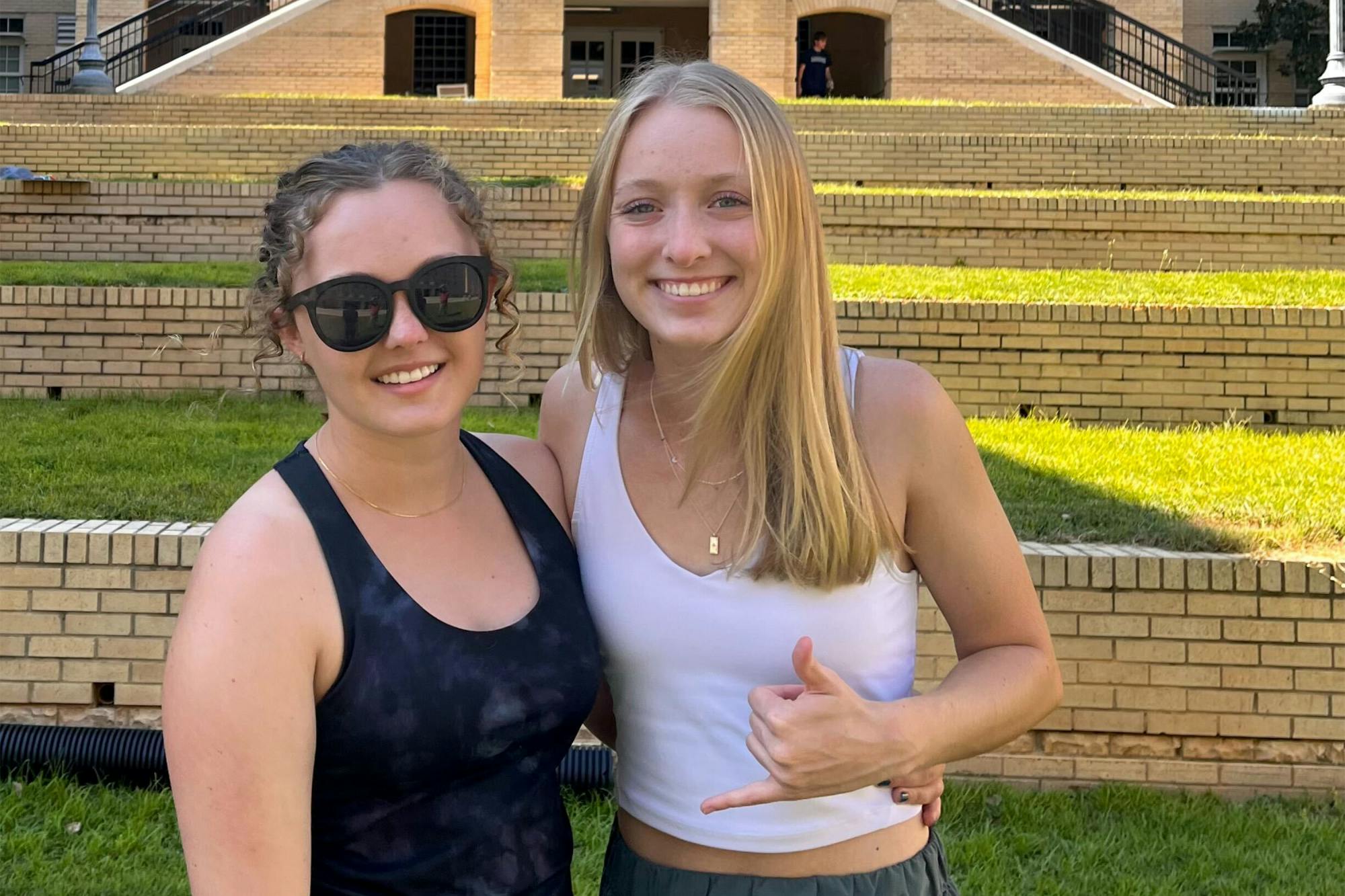 Kailey Cota (left) poses for a picture with her sister, Riley Cota (right), in front of USC’s Green Quad on Aug. 14, 2022. The class of 2026 moved in and prepared to make Columbia feel like home.