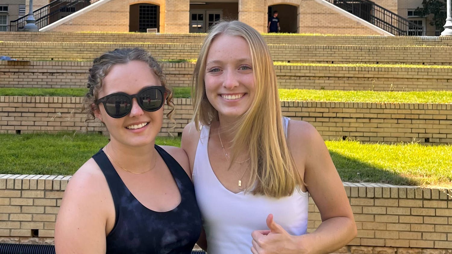 Kailey Cota (left) poses for a picture with her sister, Riley Cota (right), in front of USC’s Green Quad on Aug. 14, 2022. The class of 2026 moved in and prepared to make Columbia feel like home.