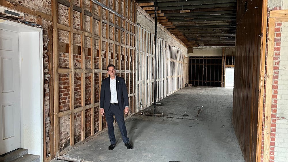 Vincent Sheheen stands inside ongoing renovation for the Camden building he is restoring on March 8, 2022. 