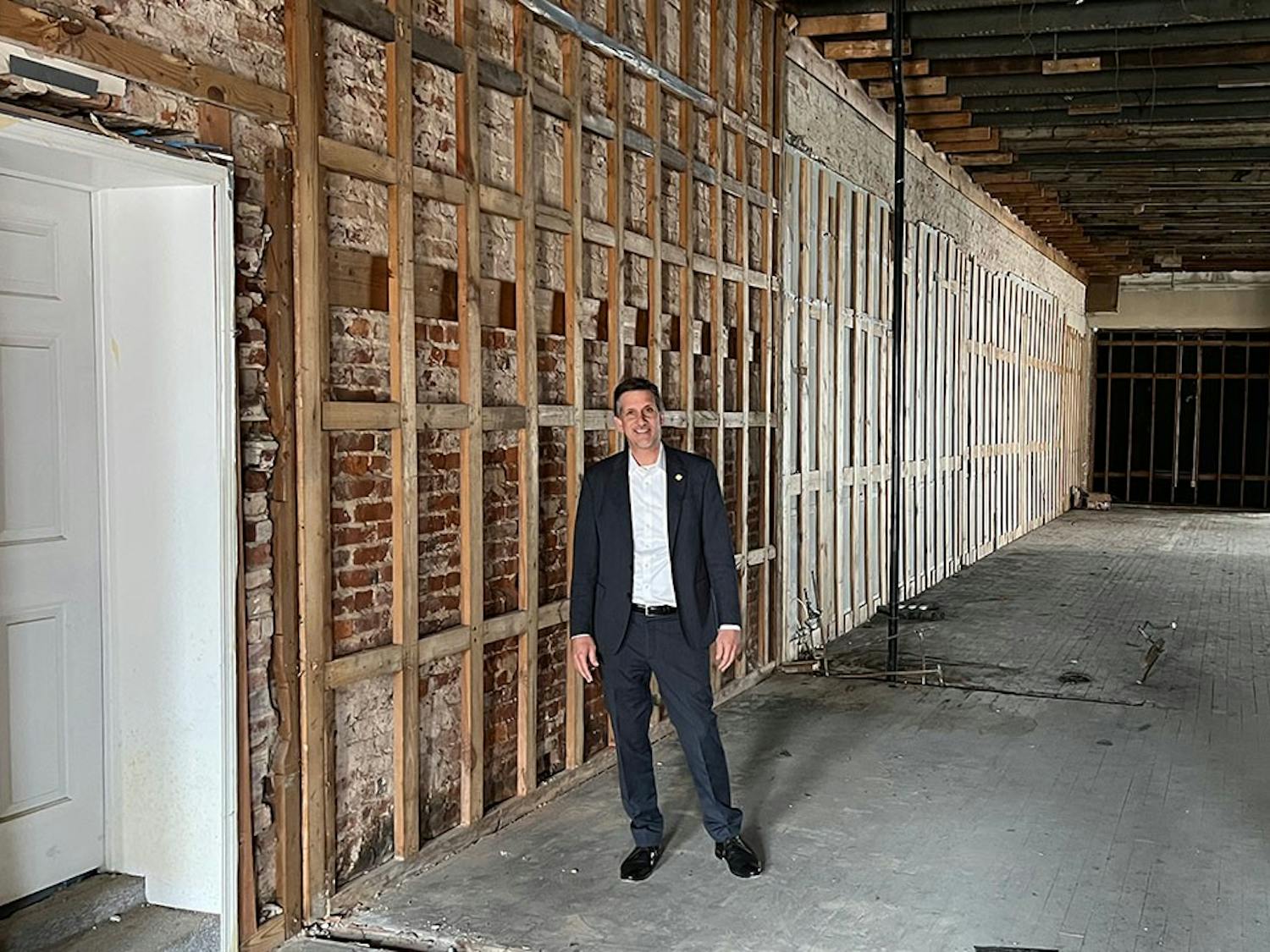 Vincent Sheheen stands inside ongoing renovation for the Camden building he is restoring on March 8, 2022.