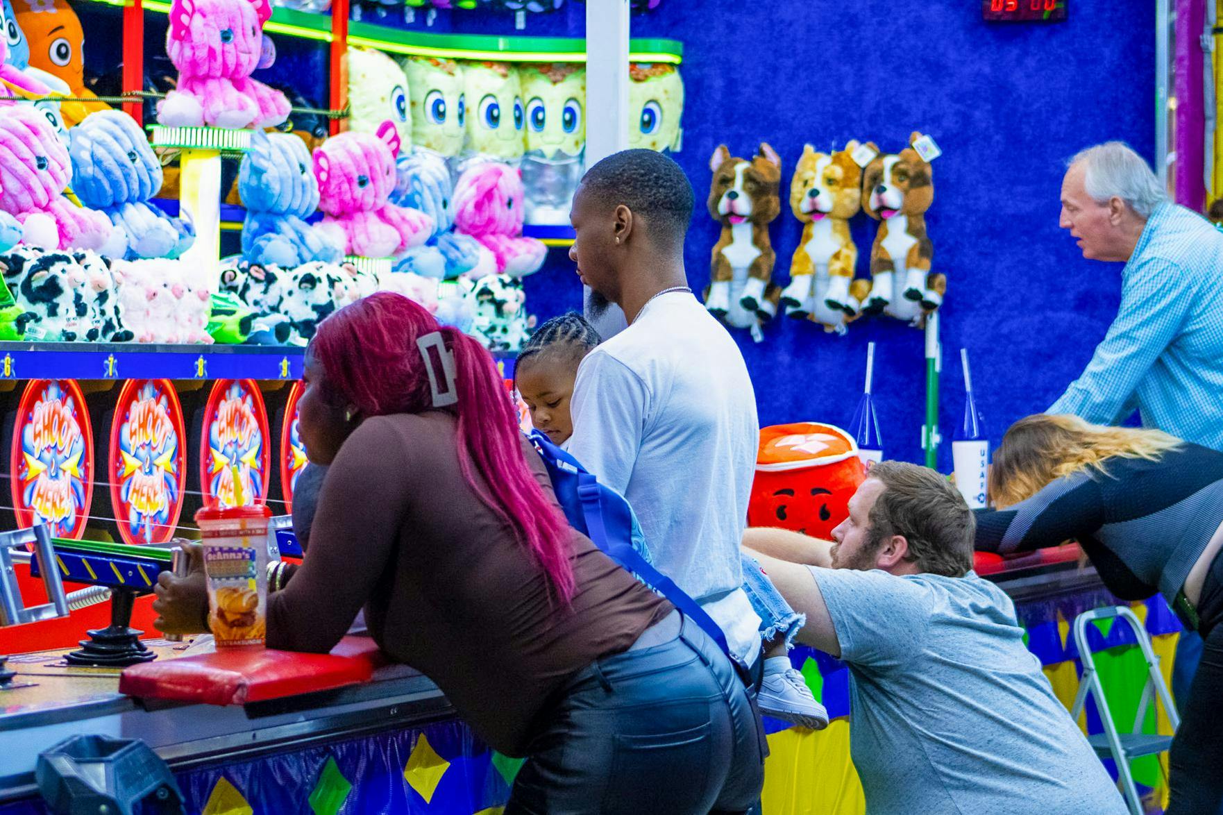 Attendees at the South Carolina State Fair in Columbia, South Carolina get ready to play the “Water Race” on Oct. 14, 2025. The fair offers a variety of games, rides, food and live entertainment for visitors from across South Carolina and many neighboring states.