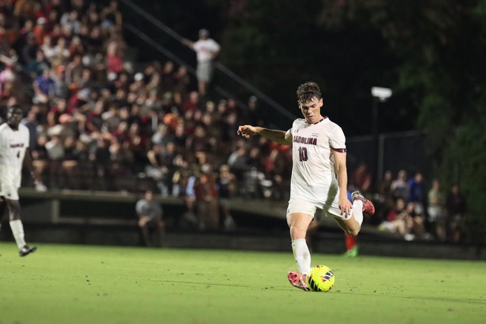 <p>Junior midfielder Ethan Ballek strikes the ball toward Clemson's net during South Carolina's game against Clemson at Stone Stadium on Aug. 30, 2024. The Gamecocks drew the Tigers 2-2.</p>