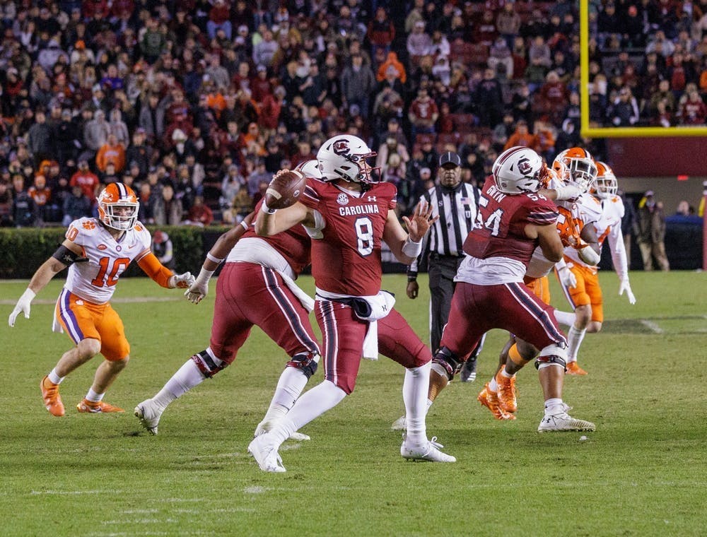 FILE—Graduate quarterback Zeb Noland passes the ball during South Carolina's game against Clemson on Nov. 27, 2021. The Gamecocks lost 30-0.