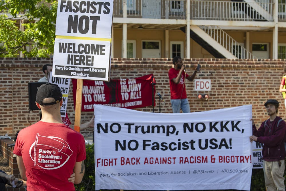 <p>Protesters hold up anti-fascism signs at the Party for Socialism and Liberation rally on April 12, 2023. The rally focused on outreach for PSL while advocating against capitalism and war spending.</p>